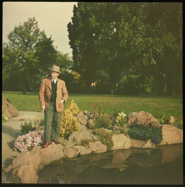 Alexander Wildey standing by a pond, 1950