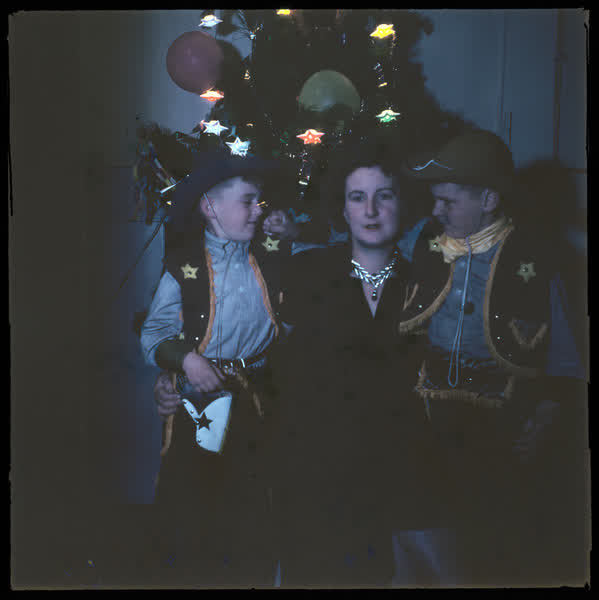Family by a Christmas tree, 1950