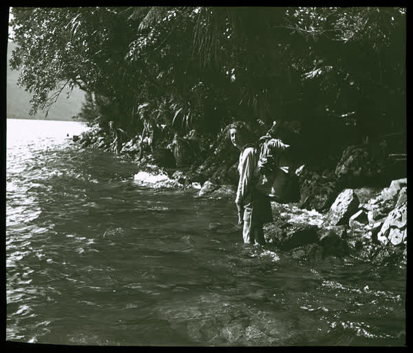 Woman wading in a lake, 1950