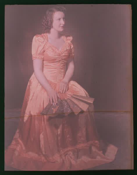 Woman in an orange gown, 1950