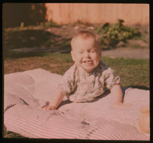 Baby sticking out its tongue, 1950