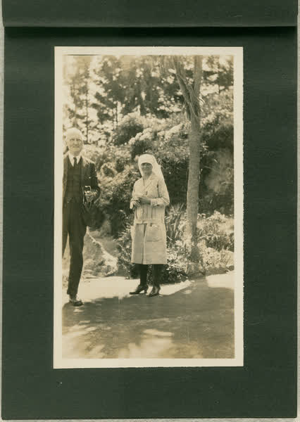 Dr Blackmore  standing outdoors with unidentified nurse, 1913
