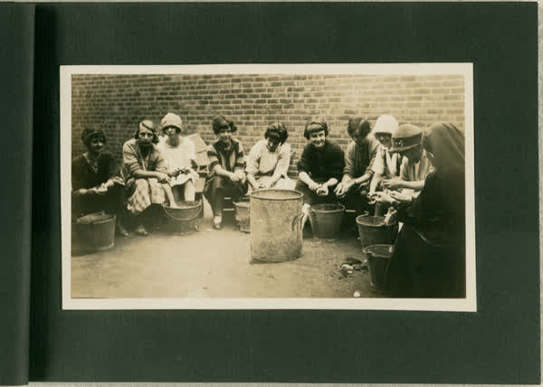 Group of women peeling potatoes, 1913