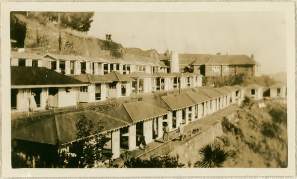 Women’s shelters from gardens on hillside, 1913