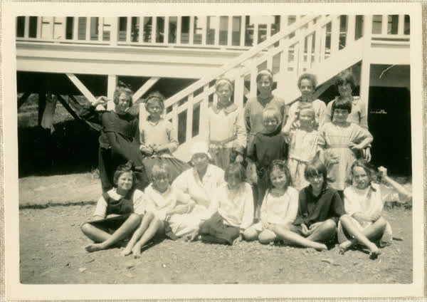 Group of children with nurse in front of Fresh Air Home, 1923