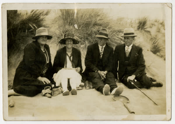 People sitting in sandhills New Brighton., 1920