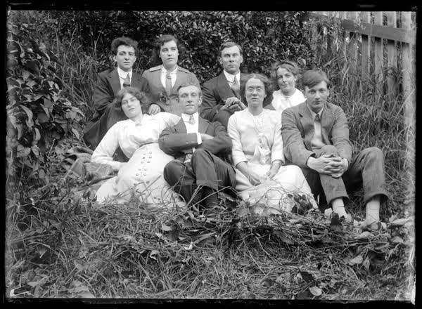 Group portrait in a garden, 1900