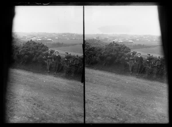 Three men at a roadside, 1900