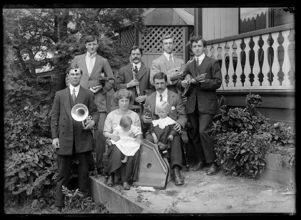 Group portrait with musical instruments, 1900