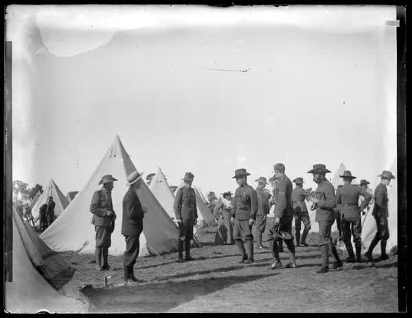Group of people among tents, 1910