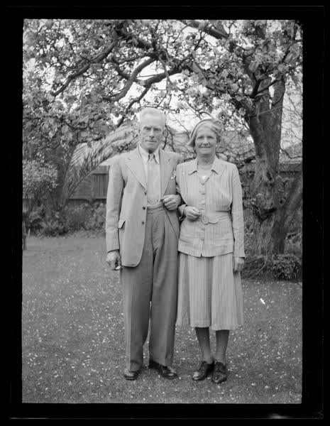 John and Ruth Sutton under a blossom tree, 1950