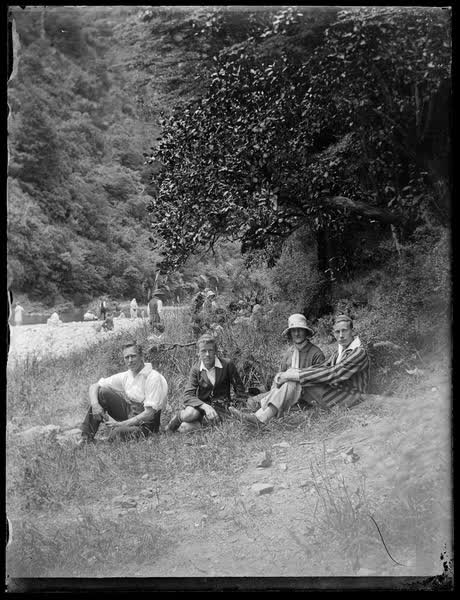 Sutton family sitting on grass, 1930