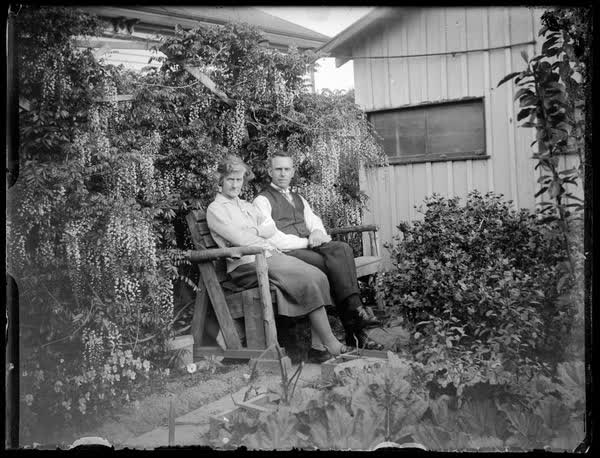John and Elizabeth Sutton sitting on a bench, 1920