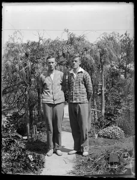 Len and Bill Sutton in a garden, 1930