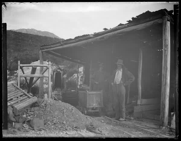 Two men at a mine, 1900