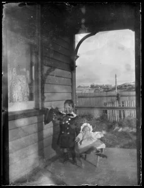 Children on a veranda, 1900