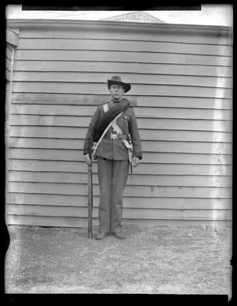 Man in uniform with a gun, 1900