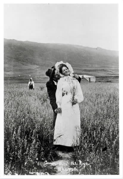 Man and woman standing in a rye fieldJan Shuttleworth collection, 1903