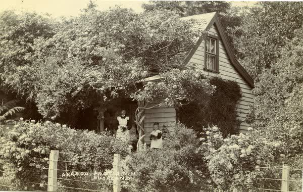 Woman and child standing on a veranda at Funnells CottageJan Shuttleworth collection, 1911
