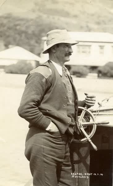 Charlie Pool standing at ships wheelJan Shuttleworth collection, 1914