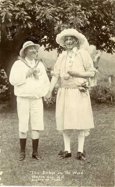 Two men dressed as children with one wearing a dressJan Shuttleworth collection, 1915