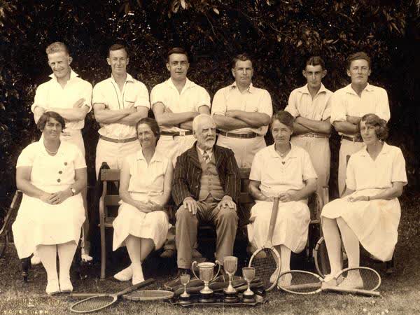 Tennis player portrait with rackets and trophiesJan Shuttleworth collection, 1925