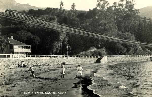 Children playing at Akaroa Beach and HarbourJan Shuttleworth collection, 1912