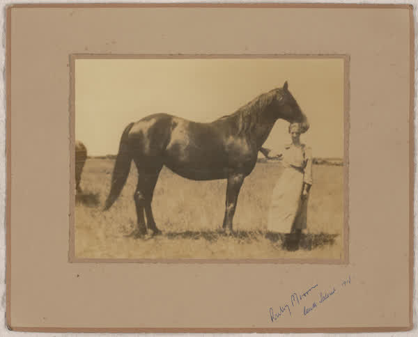 Ruby Merrin with her horse, 1918