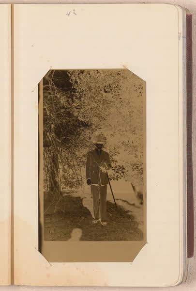 Charles Edward Storie in a suit [negative mounted in notebook], page 42, 1920