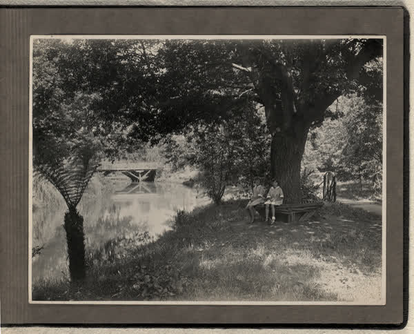 Children sitting on a bench, 1928