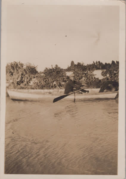 Unidentified man in a row boat, 1920