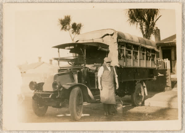 Man by a bus, 1900