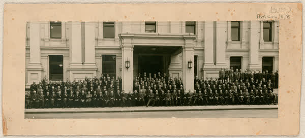 Group portrait outside a building, 1900
