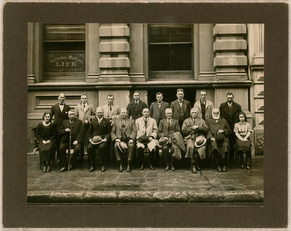 Group portrait in front of National Mutual Life building, 1930