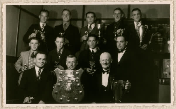 Group portrait with trophies, 1940