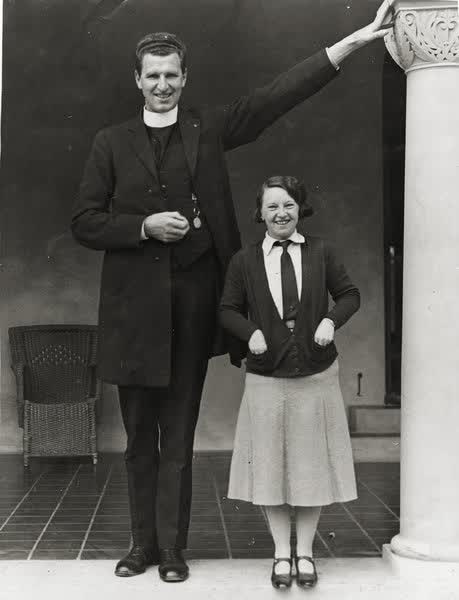 Man and a woman on veranda, 1900