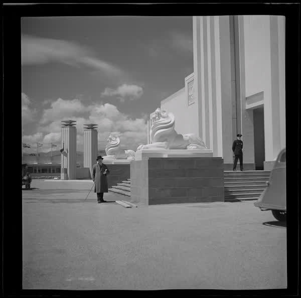 Standing next to the Art Deco lion statues, 1939