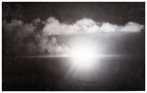 Battleship gun flash at night, 1944
