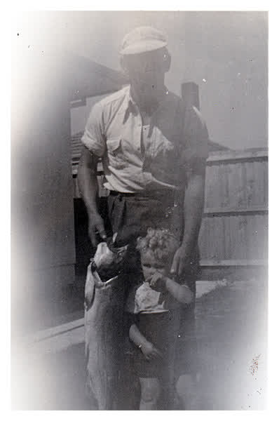 Clarence and Graham Walker with fish, 1950