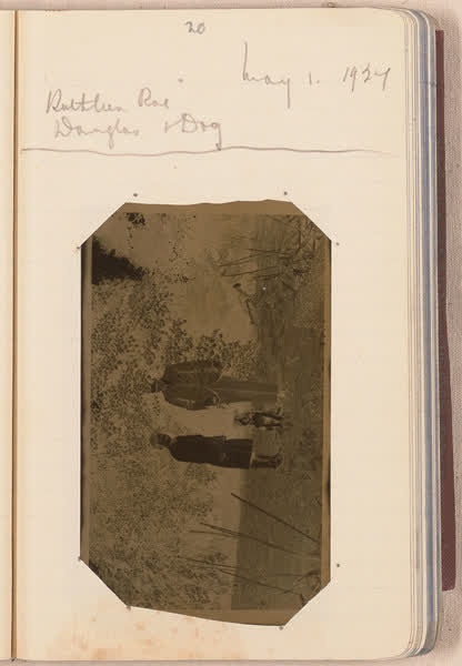 Kathleen Roe, Douglas and a dog [negative mounted in notebook], page 20, 1927