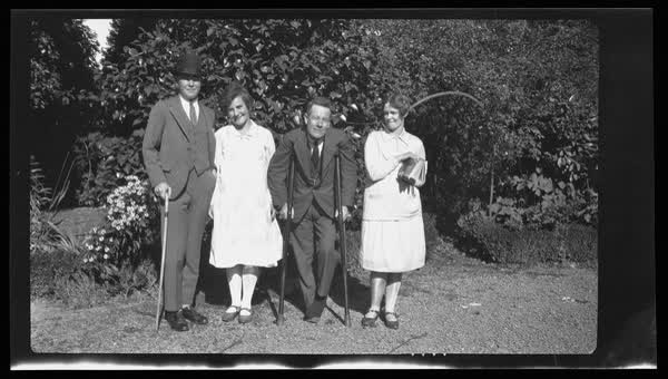 Men and women in garden, 1927