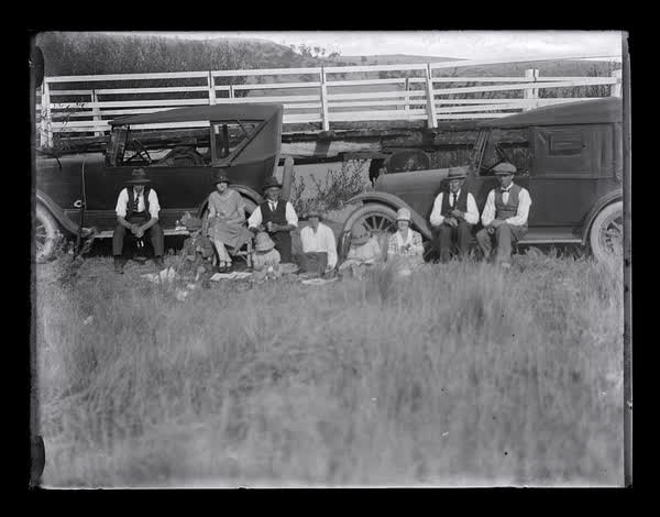 Group beside a bridge, 1919