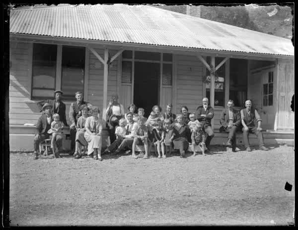 Sutton family portrait on a veranda, 1920