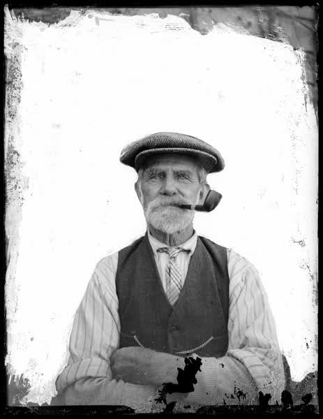 John Sutton with a pipe, 1920